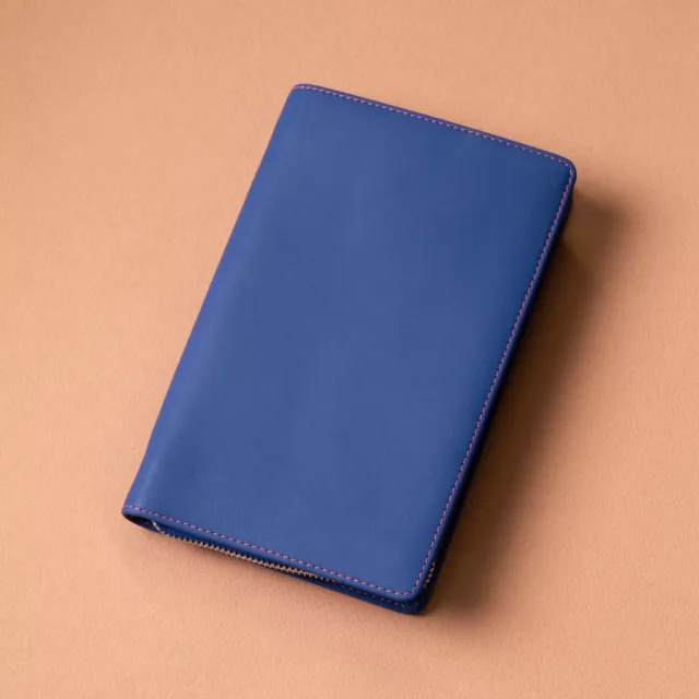 Zipped blue leather pouch with pink topstitching, a bespoke watch care kit, Maison Maëstra
