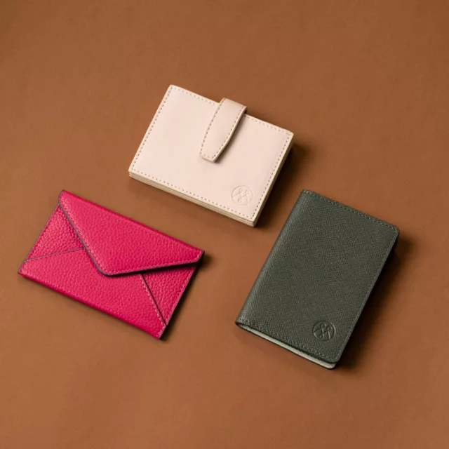 Fuchsia and cream leather card holders and a green passport cover, bespoke small leather goods
