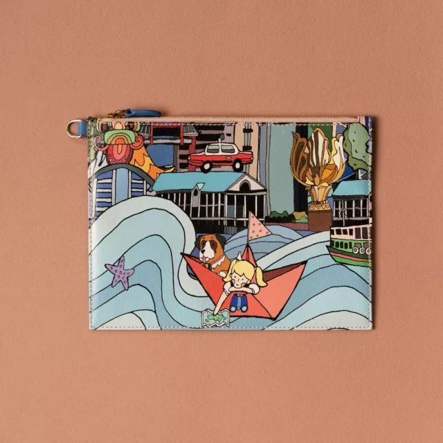 Flat leather pouch illustrated with a harbour city scene, a bespoke piece for a brand