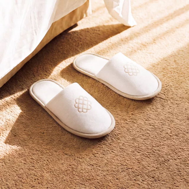 Bespoke luxury hotel slippers for a guest room, by Maison Maëstra